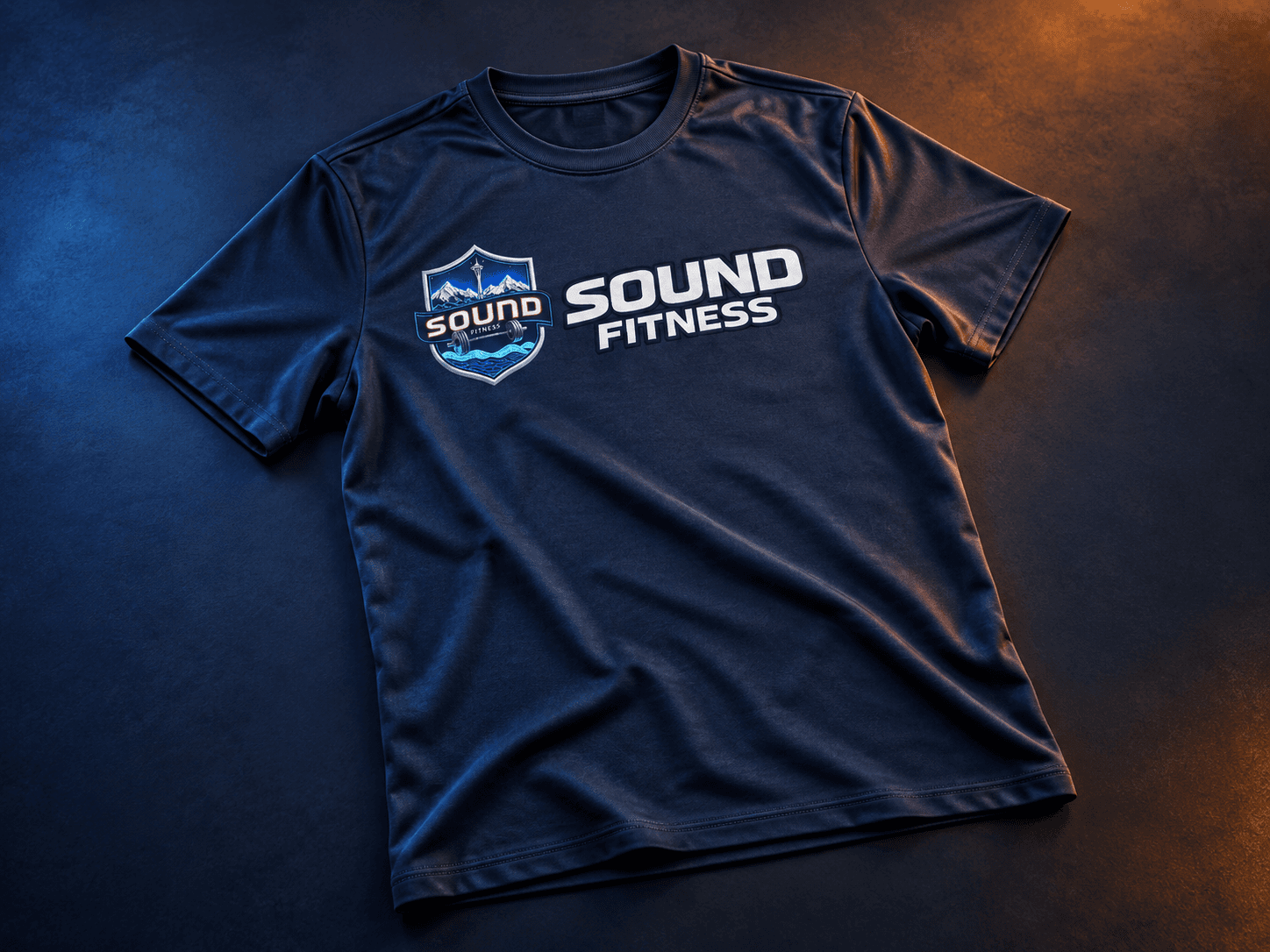 Navy Sound Fitness training shirt with the crest beside the Sound Fitness wordmark